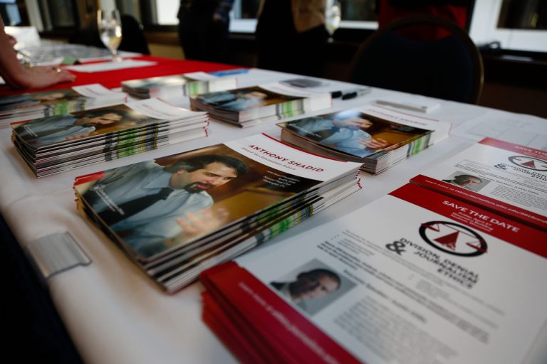 Photo of stack of brochures about the Anthony Shadid Award for Journalism Ethics