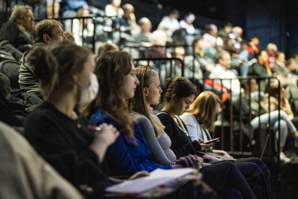 Students intently watching conversation with Katy Culver and Pete Williams