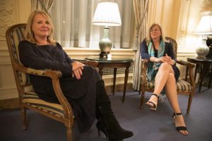 Julie K. Brown and Emily Michot sitting in chairs.