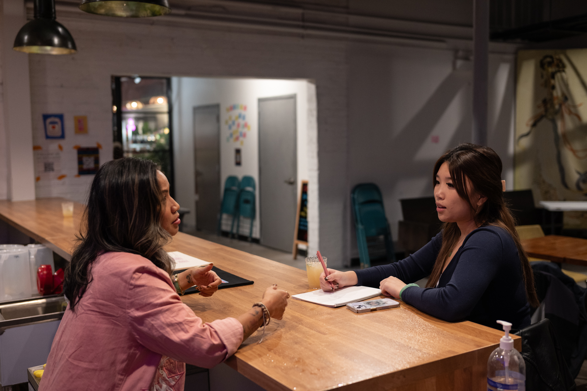 Katrina Pham reporting for Borderless Magazine. Photo courtesy of Max Herman/Borderless Magazine.