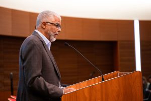 Keith Woods in profile at the podium